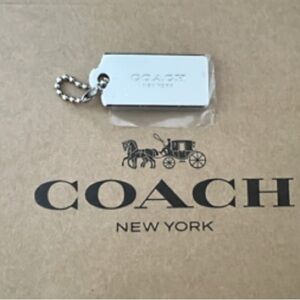 Coach Metallic Silver Bag Tag Keychain. Excellent condition
